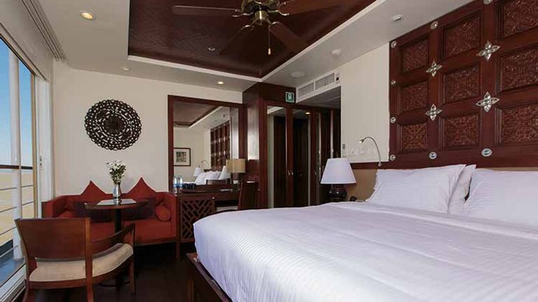 Stateroom on Avalon Myanmar feature large sliding-glass windows. // © 2016 Avalon Waterways