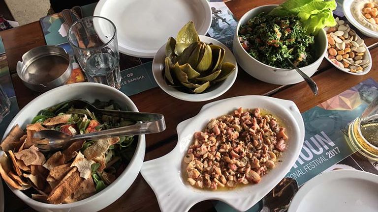 The fish is enjoyed with a variety of salads and other side dishes. // © 2017 Giselle Abcarian