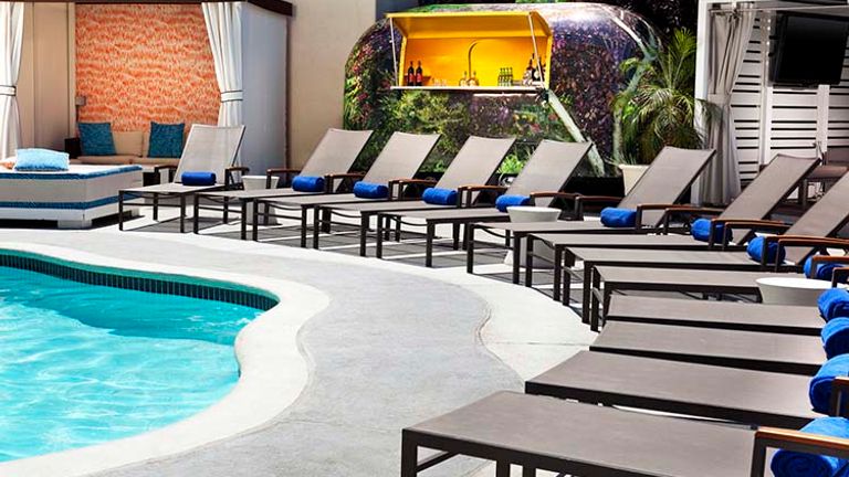 The outdoor pool area features Wet, the hotel’s signature poolside bar. // © 2016 W Hotels