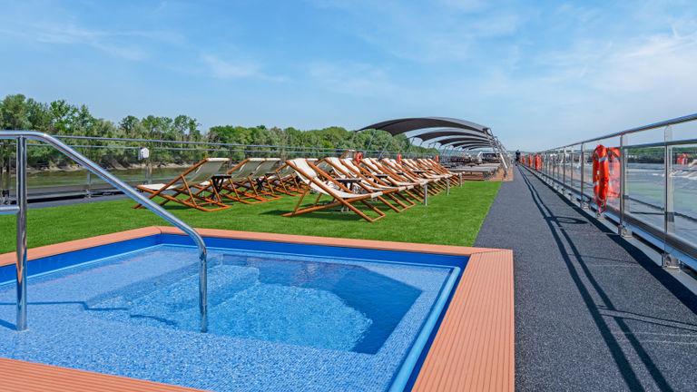 The sun deck is home to a heated pool.