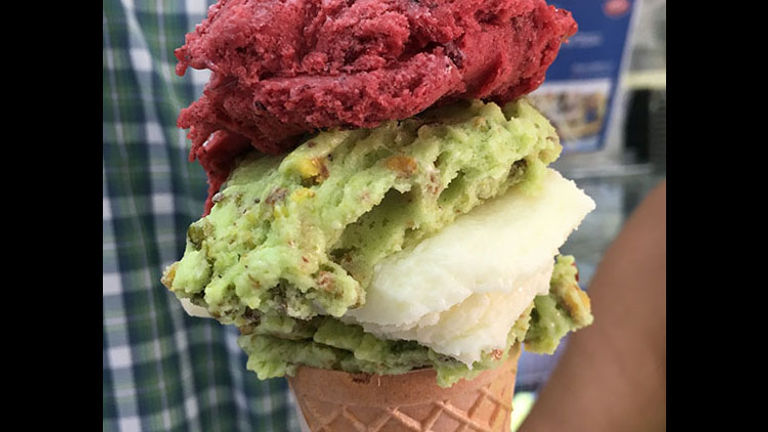 This cone features layers of pistachio, raspberry and ashta ice cream flavors. // © 2017 Giselle Abcarian